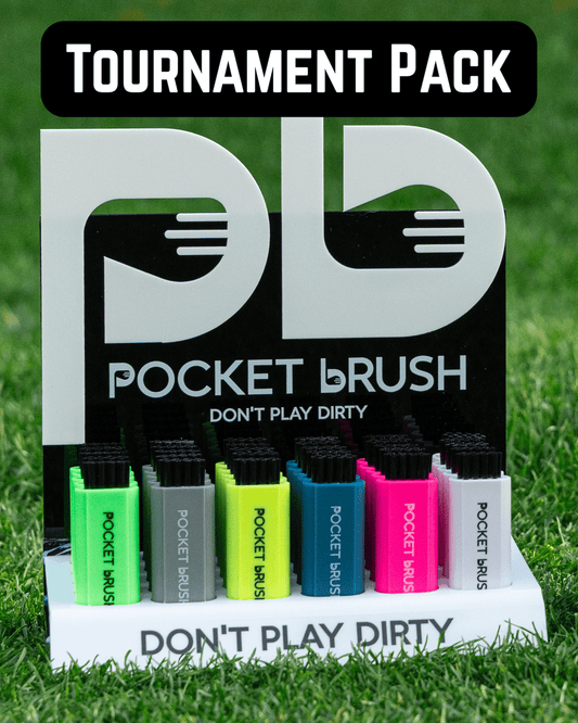 Packaging of Pocket Brush with colorful brushes on a grass background