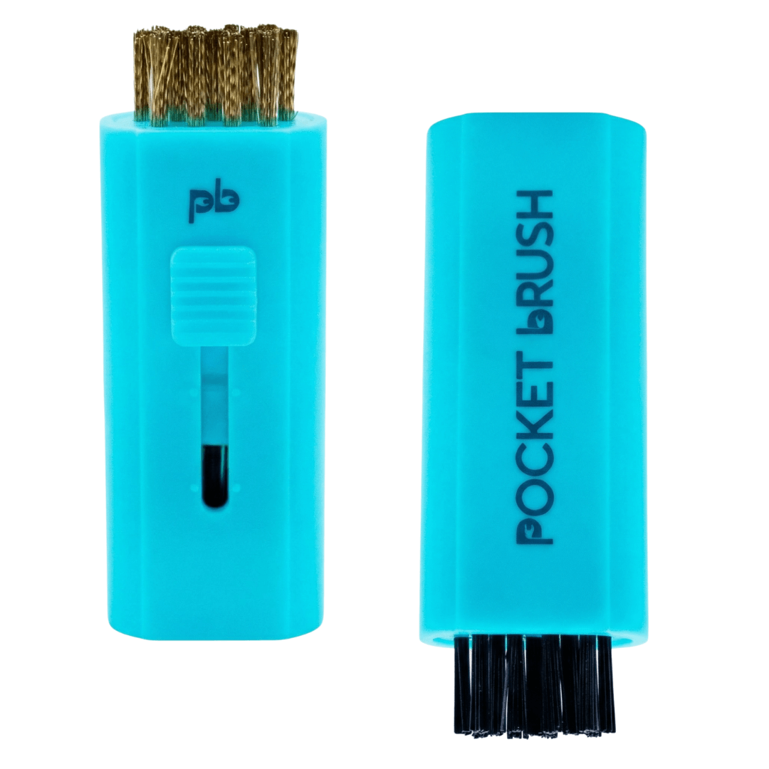 A bright blue Pocket Brush golf club brush and groove cleaner with both the brass and nylon bristles exposed lies on a white background.